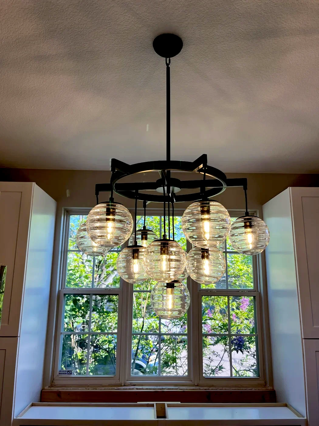 Dining room chandelier with glass globe pendants