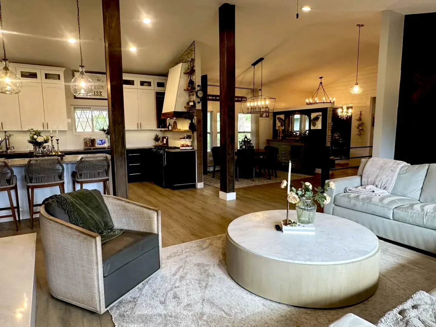 Open-plan living room with pendants and recessed lighting