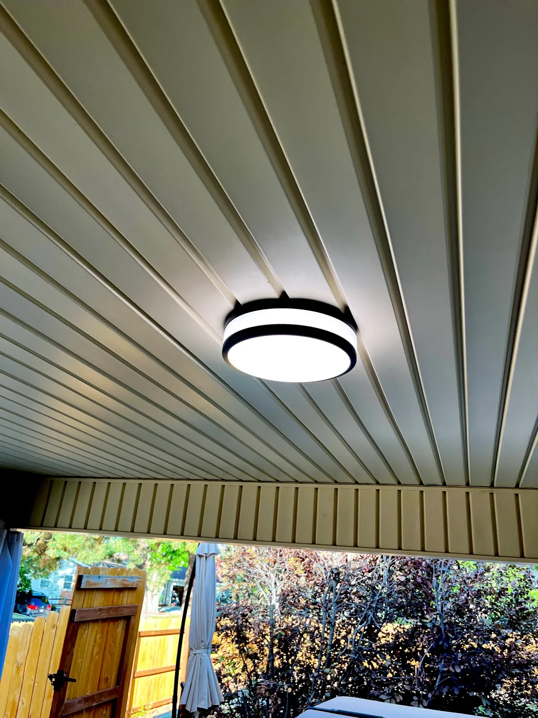 Round ceiling light on a covered patio
