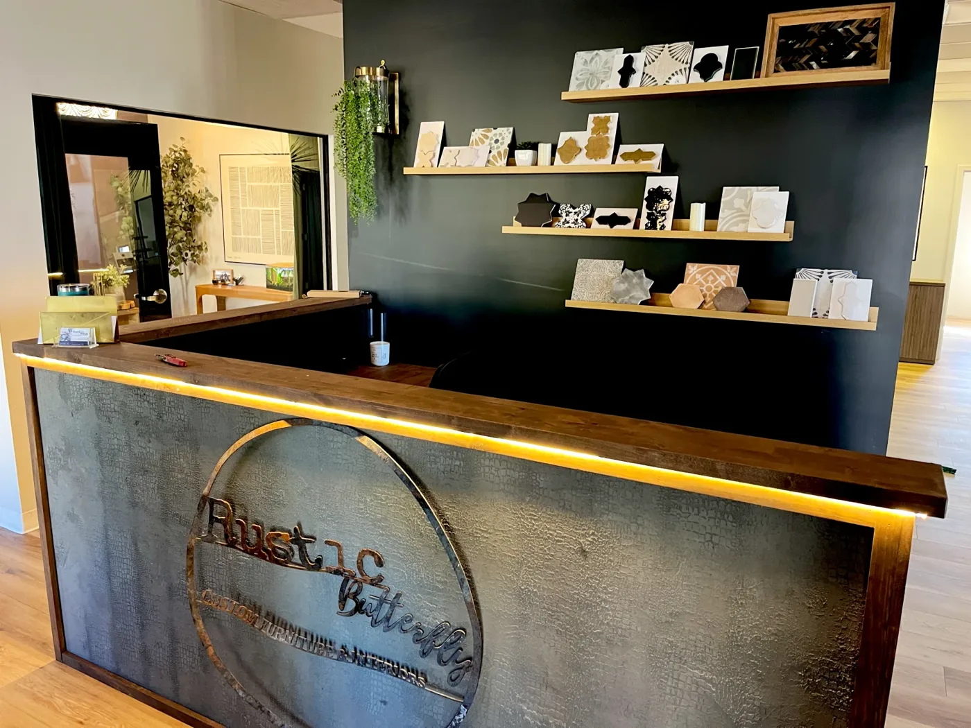 Reception desk with an LED light strip under the counter and sconce lighting