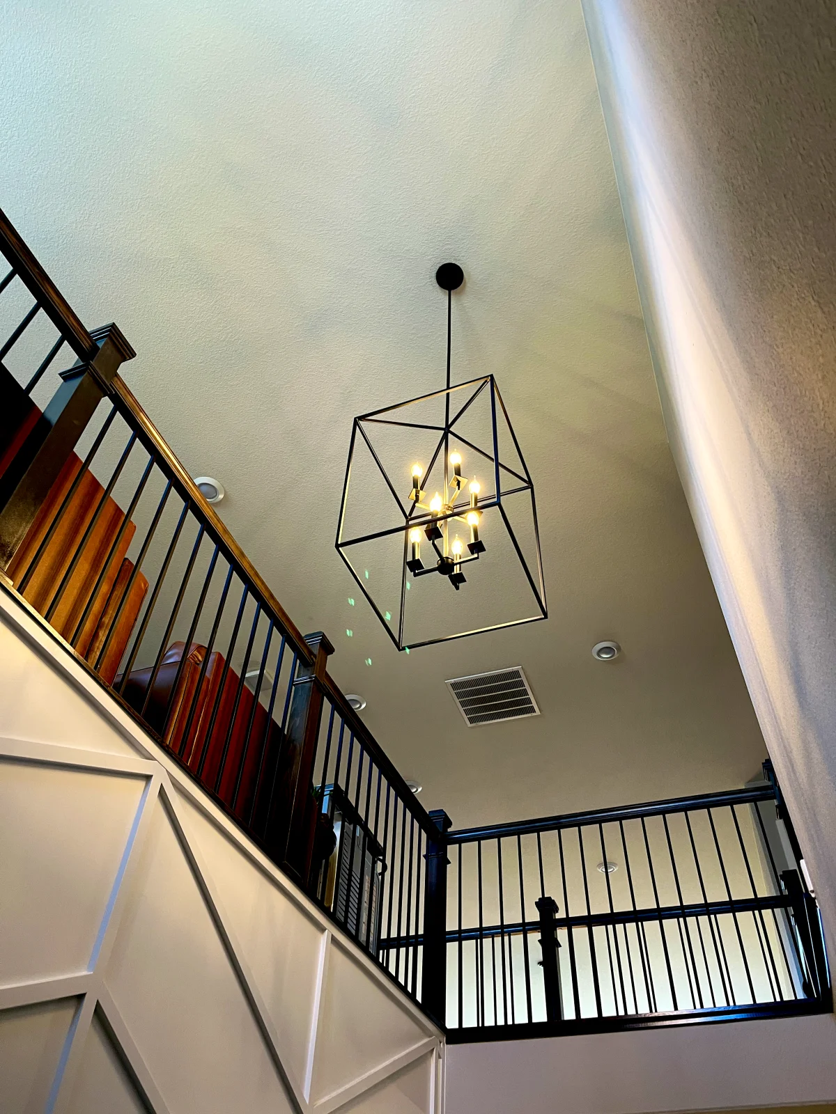 Lantern chandelier in a two-story stairwell